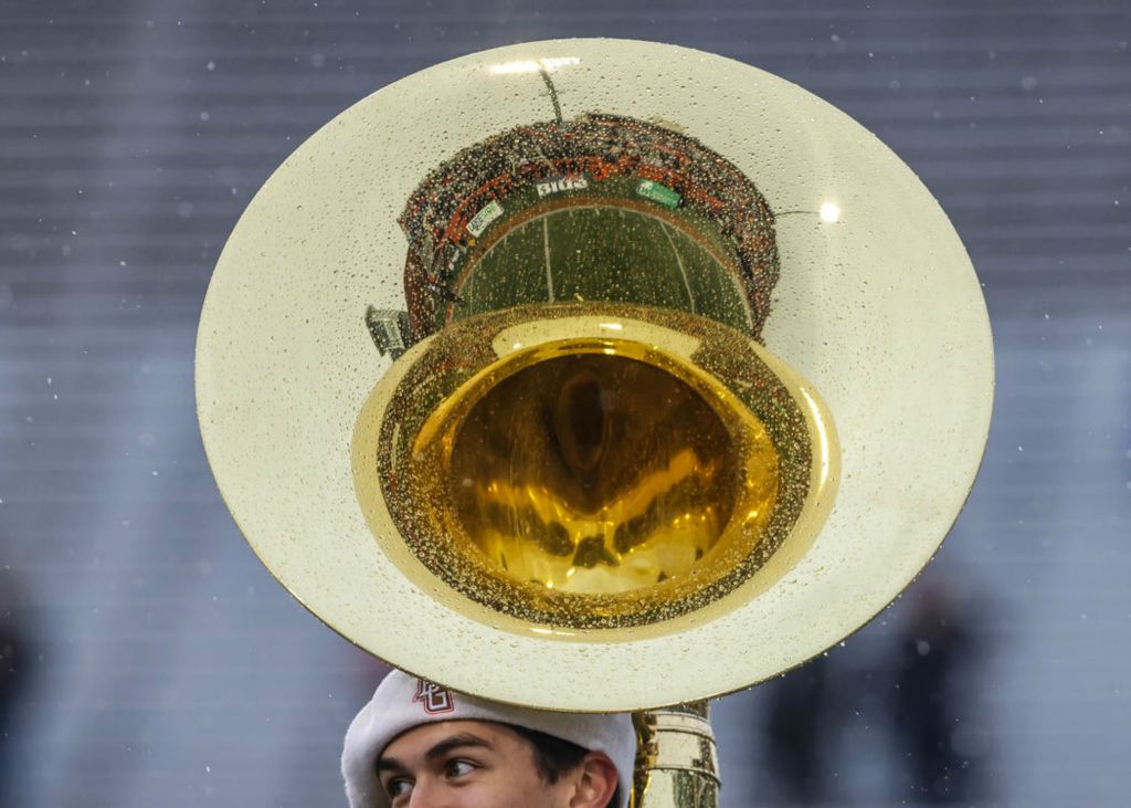 Sports Feature - 1st place - Rain sticks to Bowling Green Falcons senior marching band member Jonah Gilbert at halftime of a Mid-American Conference football game against the Akrons Zips at Doyt Perry Stadium in Bowling Green.  (Isaac Ritchey / The Blade)