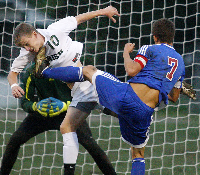 Sports - 2nd place - Thor Beckdahl (10) of Catholic Central gets kicked while defending the goal from Rylee Woods (7) of Greeneview during a soccer game at Hallinean Field. (Barbara J. Perenic / Springfield News-Sun)