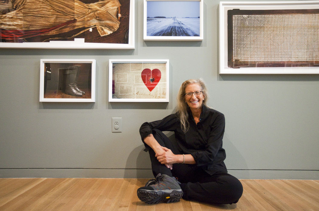 Portrait - 3rd placePhotographer Annie Leibovitz poses for a portrait while sitting in the "Pilgrimage" section of her exhibition titled "Annie Leibovitz" at the Wexner Center for the Arts in Columbus. Leibovitz is seated next to a photo taken in Ohio titled "Annie Oakley's Heart Target", an object which is housed in Ohio.  (Brooke LaValley / The Columbus Dispatch)