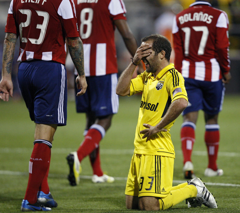 Sports Feature - 1st placeColumbus Crew midfielder Federico Higuain (33) drops to the ground after missing a shot on goal against Chivas USA during the first half of their MLS soccer game at Crew Stadium in Columbus. (Kyle Robertson / The Columbus Dispatch)