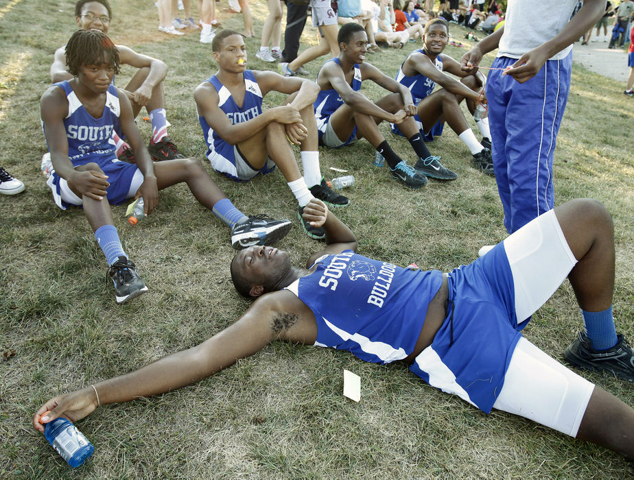 Sports Feature - 3rd placeSouth High School's Ellis Williams who is 6'8 and 260 pounds passes out on a hill after running in a cross county race at Canal Winchester High School.  The whole cross country team is made up of basketball players trying to stay in shape in the fall.  (Kyle Robertson / The Columbus Dispatch)