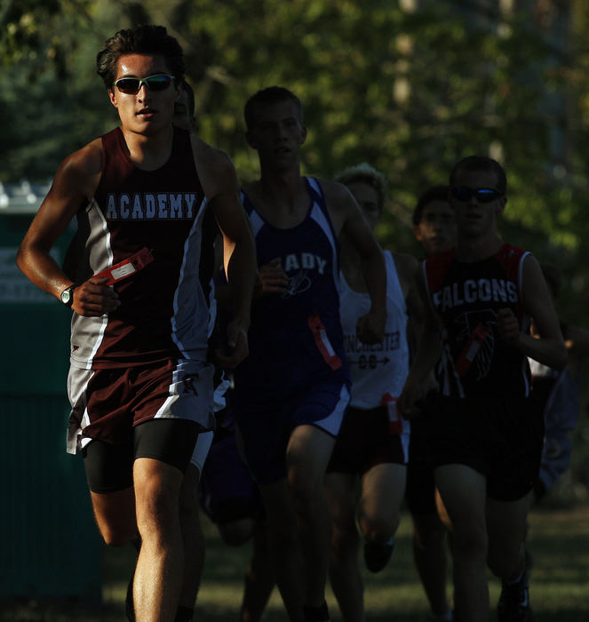 Sports - 3rd placeColumbus Academy's Aron Aziz leads a pack of runners at the Canal Winchester Invitational at Canal Winchester High School. (Kyle Robertson / The Columbus Dispatch)