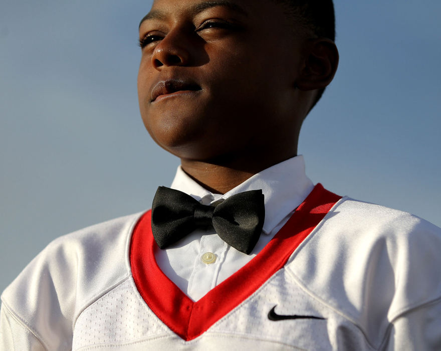 Portrait - 1st placeGlenville freshman Coby Bryant, 14, dresses in a bow tie just before their football game at Solon High School. (Lisa DeJong / The Plain Dealer)