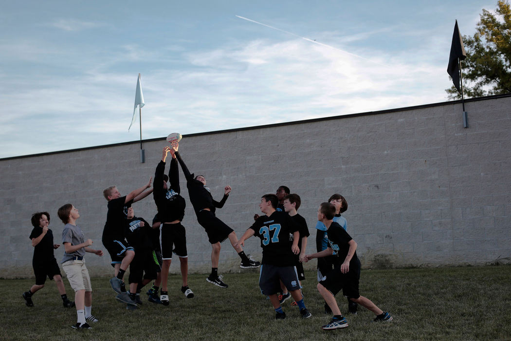 Sports Feature - 1st placeA group of young Hilliard Darby fans play a game of catch before Hilliard Darby's football game against Hilliard Davidson. (Joshua A. Bickel / ThisWeek Newspapers)