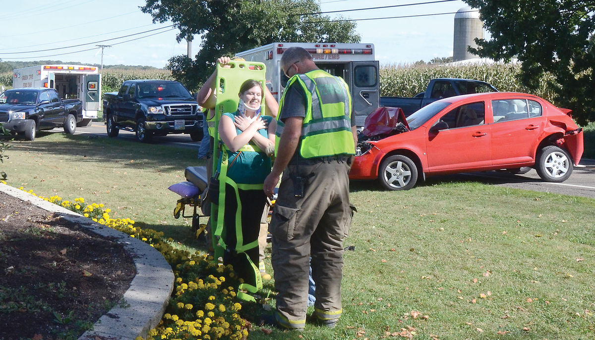 Spot News - 1st placeGreen Township EMS prepares to transport Jennifer McDonough of Youngstown who was hurt in a three-car accident on SR 14 east of Washingtonville.  (Patricia Schaeffer / The (Lisbon) Morning Journal)