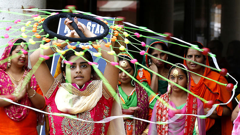 Feature - HM - The Singh Indian Dancers perform a traditional Indian dance at Culturefest in Springfield.  (Bill Lackey / Springfield News-Sun)