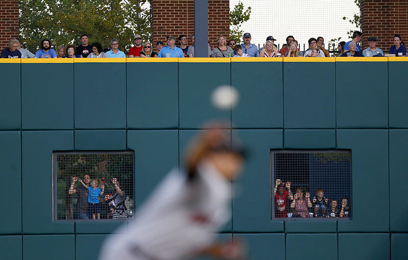 Sports Feature - 3rd place - A standing room only crowd both in the park (top) and outside the park (bottom look throughs) watch as Indianapolis Indians pitcher Wilfredo Boscan (46) delivers to the plate during the second game of the Governors' Cup Championship between the Clippers and the Indianapolis Indians at Huntington Park.  (Jonathan Quilter / The Columbus Dispatch)