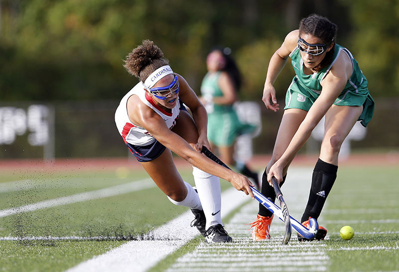 SSports - 3rd place - Thomas Worthington's Sarah Charley (4) hits a shot past Dublin Scioto's Alexis Kennedy (11) during the field hockey match at Thomas Worthington.  (Adam Cairns / The Columbus Dispatch)