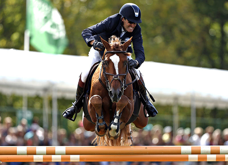 spoSports - HM - Paul O'shea and his horse Skara Glen's Dolphin of Wellington, Florida clear the last jump at the 18th New Albany Classic Invitational Grand Prix and Family Day. The New Albany Classic was founded by Abigail Wexner to raise money to prevent domestic violence and support victims of abuse. (Leah Klafczynski / The Columbus Dispatch)