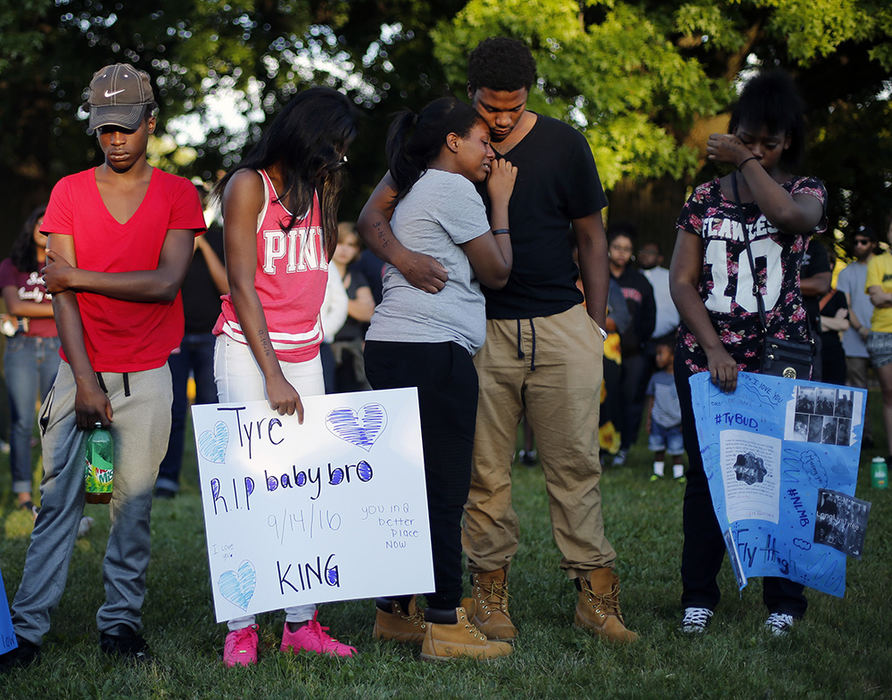 General News - 3rd place - Family and friends holds each other during a vigil for 13-year-old Tyre King after he was shot and killed yesterday by Columbus Police. (Kyle Robertson  / The Columbus Dispatch)