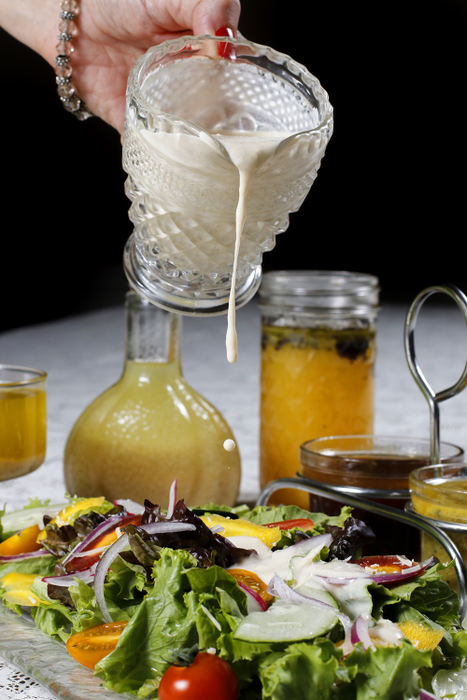 Illustration - 1st place - Creamy garlic parmesan dressing is poured onto a fresh summer salad.  (Andy Morrison / The (Toledo) Blade)