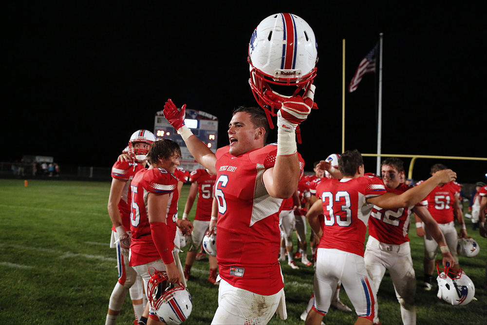 Sports Feature - 3rd place - Patrick Henry High School's Kent Peterson (6) and his team celebrate their upset win over third-ranked Liberty Center High School after their game at Patrick Henry High School. (Andy Morrison / The (Toledo) Blade)