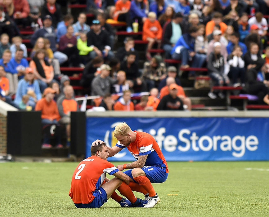 Sports Feature - 3rd place - Matt Bahner gets a pat on the head from teammate Sam De Wit after playing to a 1-1 draw against the Pittsburgh Riverhouds at Nippert Stadium in Cincinnati.  (Erik Schelkun / Elsestar Images)