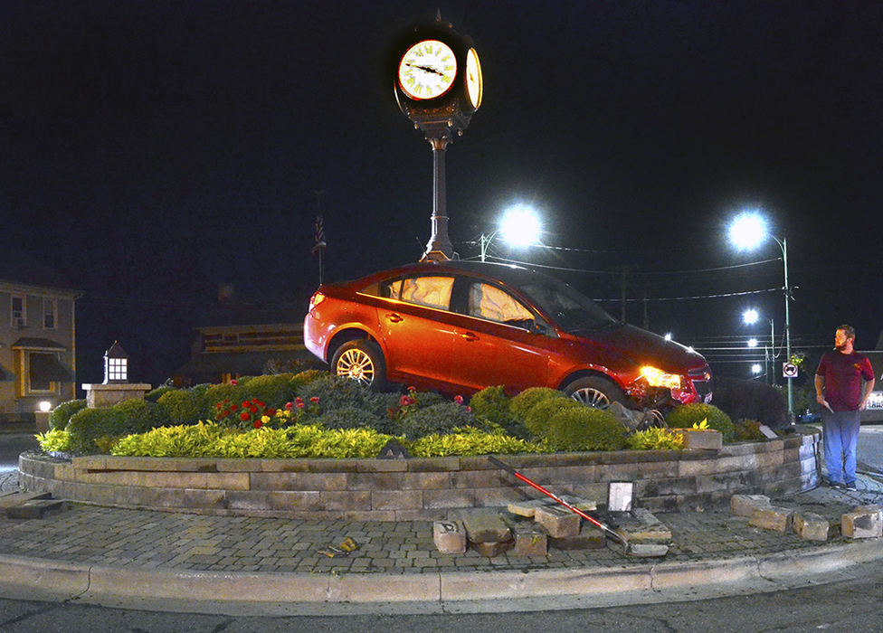 Spot News - 2nd place - Shane Organ of Columbiana woke up on the wrong side of the circle. He was on top of it, but not injured except for a few cuts and bruises on his hands. Organ had worked a long day of construction and maintenance and fell asleep on his way home shortly after 3 a.m., ending up in the decorative traffic circle. Organ was administered a field sobriety test and found not to be under the influence of any drugs or alcohol.  (Patricia Schaeffer / The (Lisbon) Morning Journal)