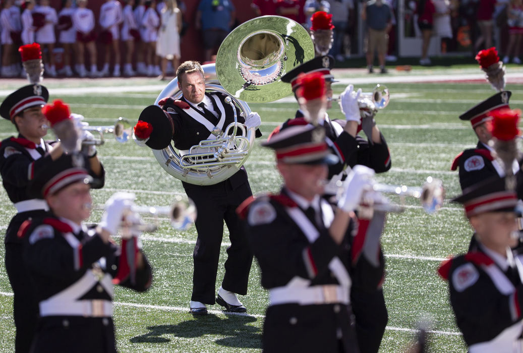 Feature - 1st placeOhio State University Marching Band member Taylor Thompson of Marysville dots the i in "Script Ohio" prior to the Buckeyes game at Memorial Stadium in Bloomington, Indiana. (Adam Cairns / The Columbus Dispatch)