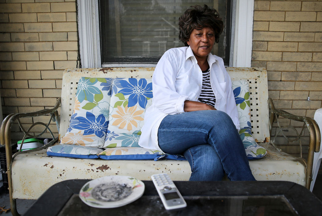 Portrait - 2nd placeValerie Tokoto-Dayas, 74, poses for a portrait at her home in Avondale. The lifelong resident moved once before in the 1990s because of Cincinnati Children's Hospital expansion, and has received a grant as part of the hospital's initiative to help develop the neighborhood.  (Kareem Elgazzar / The Cincinnati Enquirer)