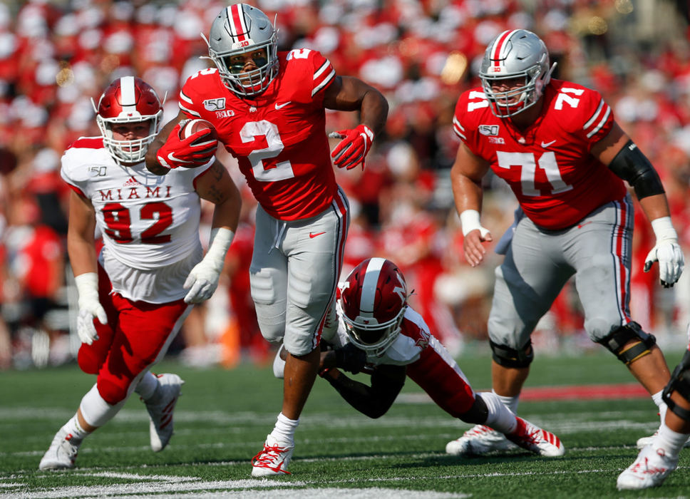 Sports - HMOhio State Running back J.K. Dobbins (2) runs for a touchdown to take a 7-5 lead over the Miami Redhawks at Ohio Stadium in Columbus. (Maddie Schroeder / The Columbus Dispatch)