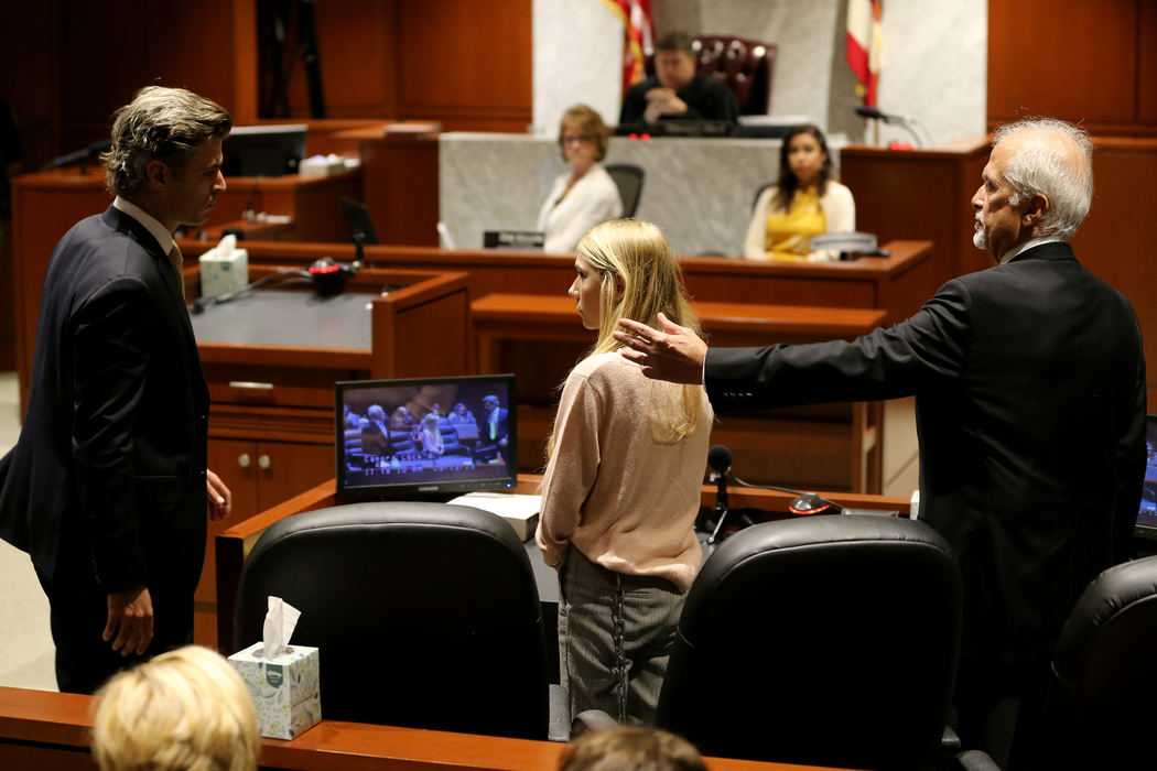 Story - 3rd placeDefense attorney Charles H. Rittgers (right) gestures shortly before Brooke Skylar Richardson was sentenced to three years probation and seven days of time served after being found guilty of gross abuse of a corpse in Warren County Judge Donald Oda's II courtroom in Lebanon. (Kareem Elgazzar / The Cincinnati Enquirer)