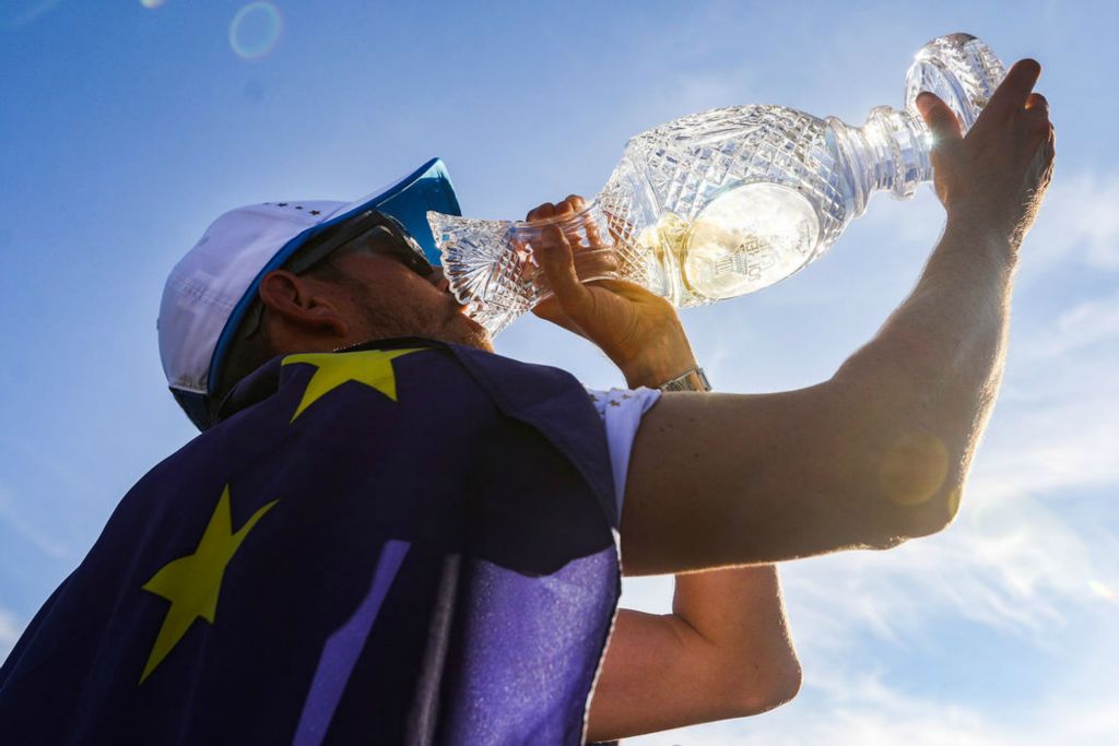 Story - 1st place - A Team Europe caddie drinks champagne from the Solheim Cup to celebrate his team’s 15-13 win over Team USA during the trophy presentation for the 2021 Solheim Cup at Inverness Club in Toledo. (Rebecca Benson / The Blade)