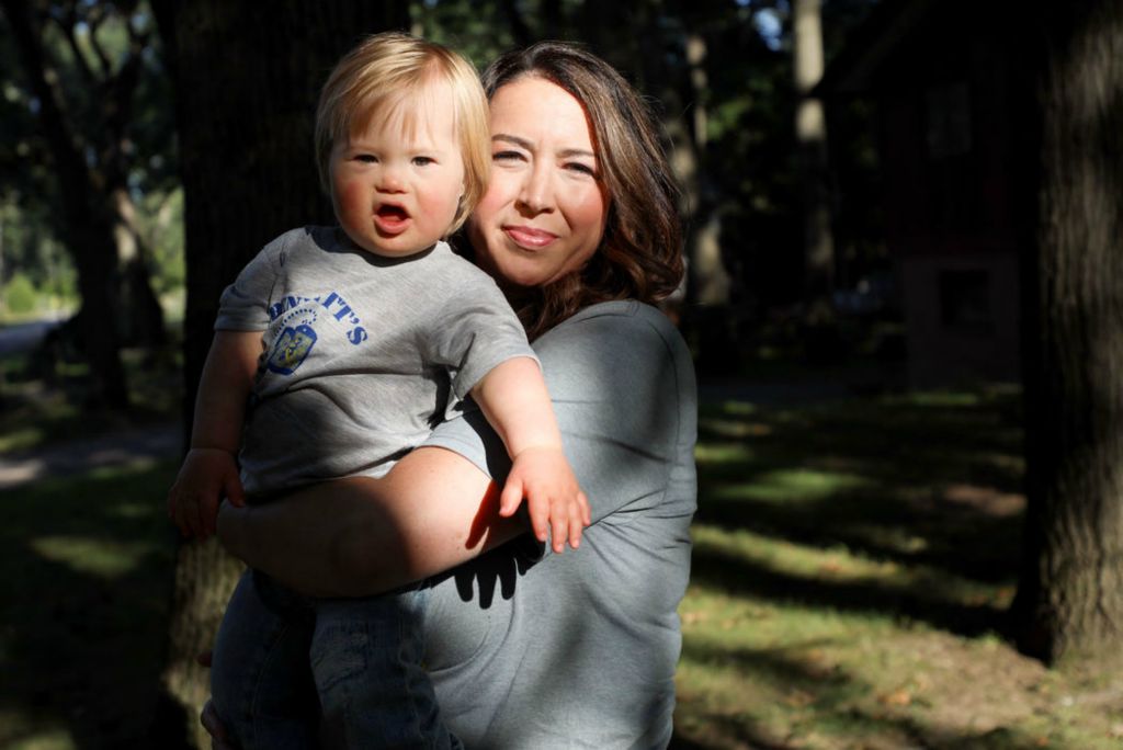 Portrait - 1st place - Andrea Carey and her 18-month-old son, Bennett, pose for a portrait outside their home in Sylvania. A picture of Bennett will be featured in a video by the National Down Syndrome Society that will be displayed in New York City’s Time Square on Sept. 18, the day of NYC’s 2021 Buddy Walk. (Kurt Steiss / The Blade)