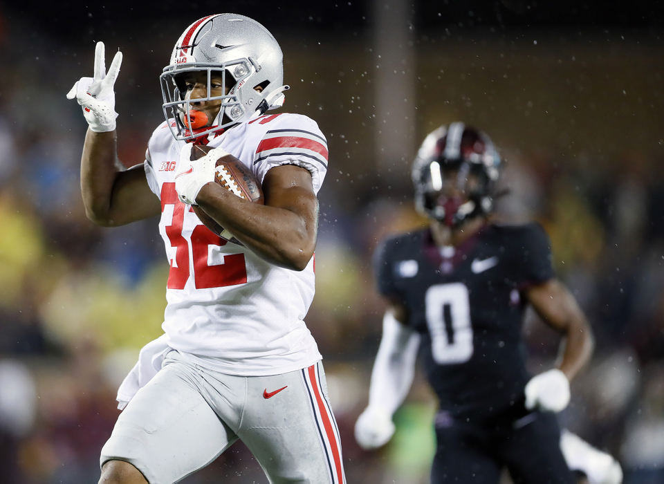 Sports - 2nd place - Ohio State running back TreVeyon Henderson (32) scores a touchdown after a catch against Minnesota during the fourth quarter of their game in Huntington Bank Stadium at the University of Minnesota in Minneapolis. (Kyle Robertson / The Columbus Dispatch)