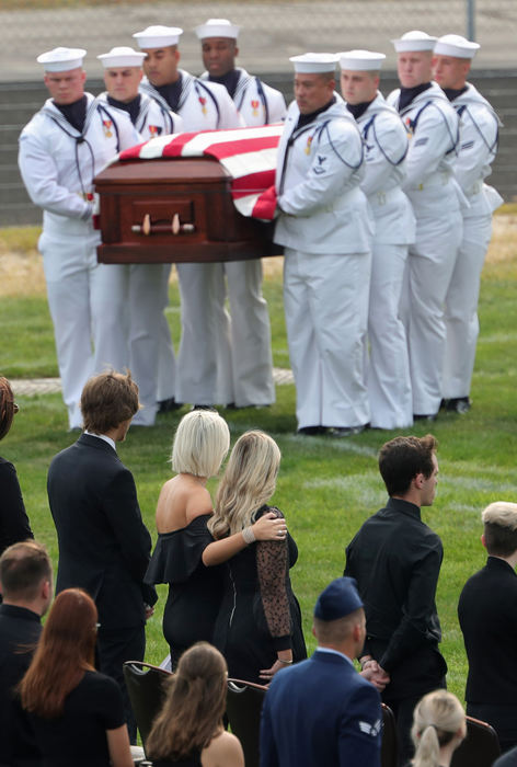 Story - 2nd place - Family members look on as the flag-draped casket of Hospital Corpsman 3rd Class Maxton Soviak is brought into the football stadium during a funeral service at Edison High School in Milan. (Jeff Lange / Akron Beacon Journal)