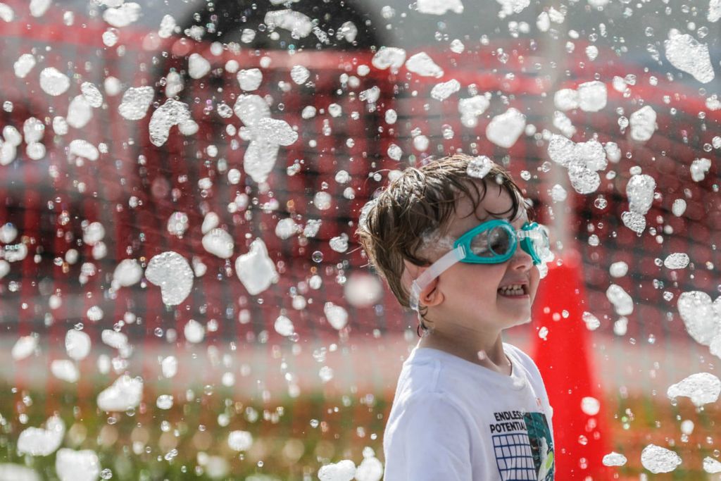 General News - 2nd place - Perrysburg resident Findley Black, 3, stands underneath a stream of falling bubbles during the 2nd Annual 419 Taco War at Lucas County Fairgrounds in Maumee. (Isaac Ritchey / The Blade)