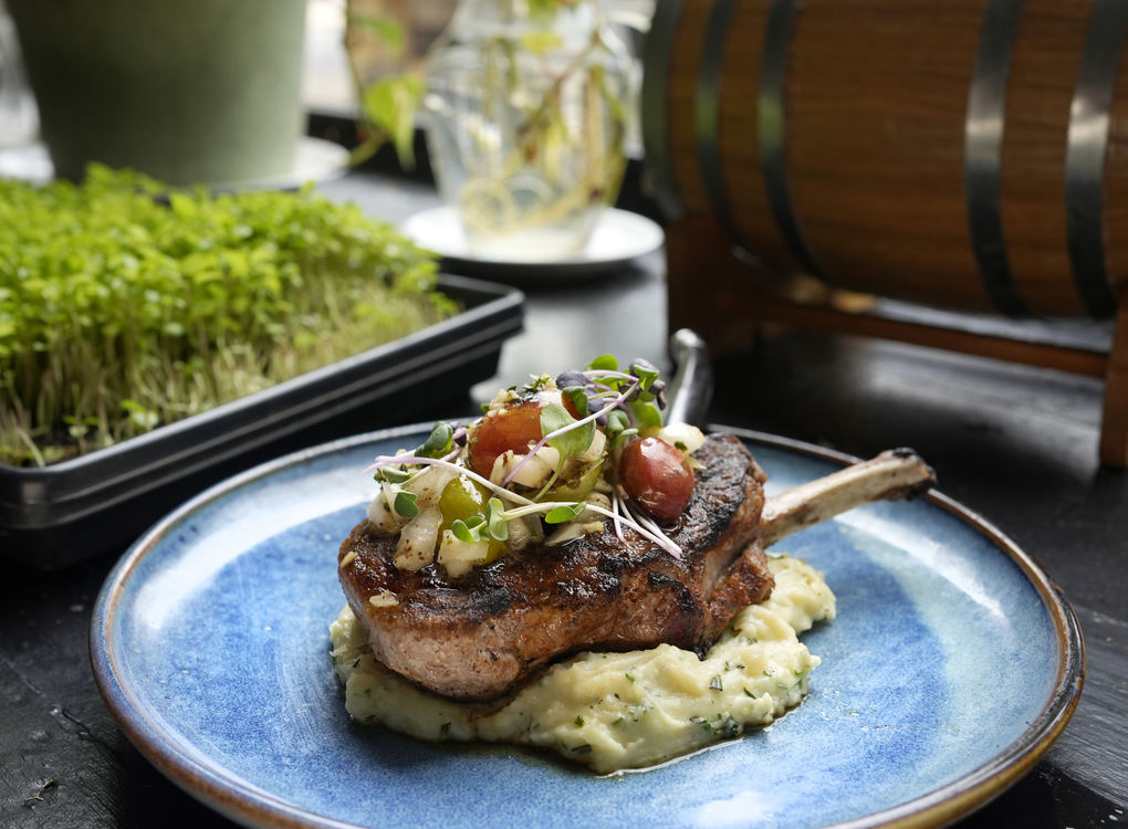 Illustration - 2nd place - Offerings from 	Alqueria for Columbus Restaurant Week include a smoked Cajun spiced pork loin accompanied by a chimichurri potato puree and charred heirloom tomato salad.  (Barbara J. Perenic / The Columbus Dispatch)