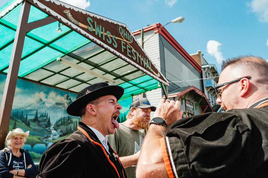 Feature - 3rd place - Daniel Birch's mouth is inspected after finishing his half pound portion of Swiss cheese in the cheese eating competition during the 70th annual Ohio Swiss Festival, in Sugarcreek. Daniel won the competition. (Andrew Dolph / The Times Reporter)