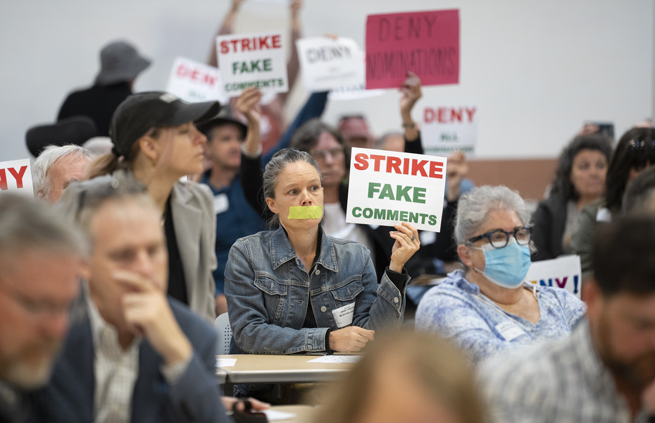 General News - 2nd place - Morgan Hager of Meigs County has taps over her mouth while she protests during a meeting that was held by the Oil and Gas Land Management Commission to determine whether to let private companies bid for contracts on different parcels of land in Ohio.  (Brooke LaValley / The Columbus Dispatch)