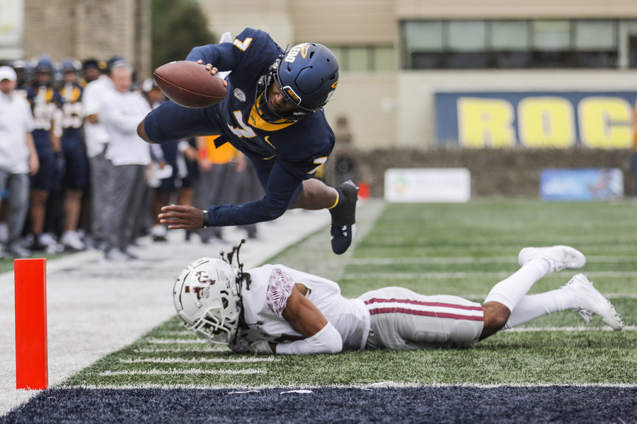 Sports - 2nd place - Toledo’s Dequan Finn dives just short of the end zone over Texas Southern’s Xavier Player at the University of Toledo’s Glass Bowl in Toledo. (Rebecca Benson / The Blade)