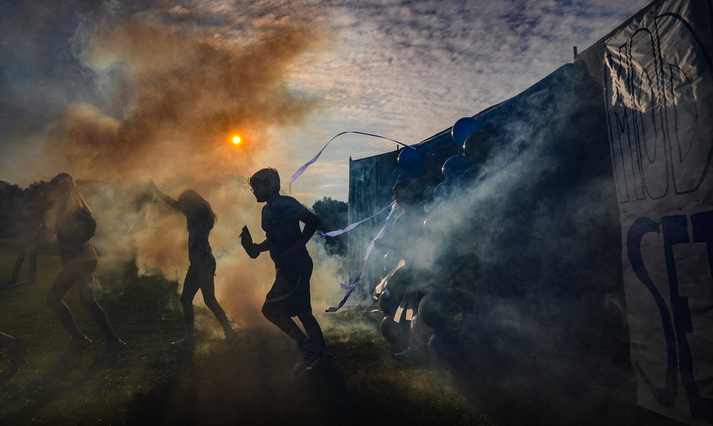 Feature - 3rd place - Sixth graders charge through smoke to find out which Harry Potter inspired “house” they will join for the school year at Fallen Timbers Middle School in Whitehouse. Students will earn points for their “house “ by adhering to 7 principles of good behavior to win a weekly award.  (Jeremy Wadsworth / The Blade)