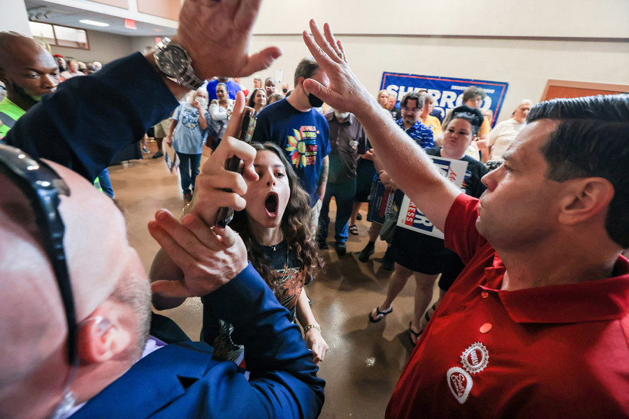 General News - 1st place - A Pro-Palestine protester yells as she is escorted out of the Organizing for Ohio rally at Plumbers and Pipefitters, Local 50 in Northwood. (Rebecca Benson / The Blade)