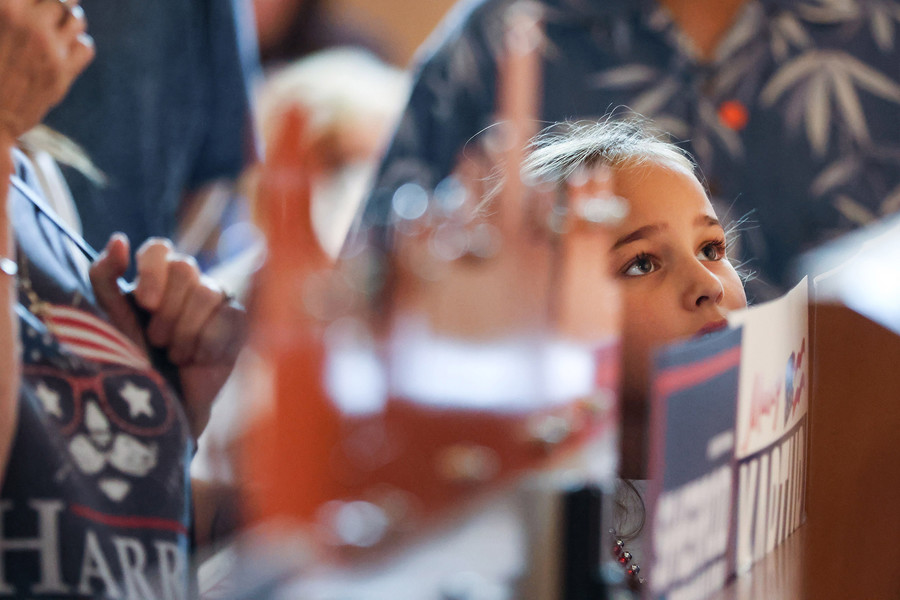 General News - HM - Morgane Shull listens to a speaker during the Organizing for Ohio rally at Plumbers and Pipefitters, Local 50 in Northwood. (Rebecca Benson / The Blade)