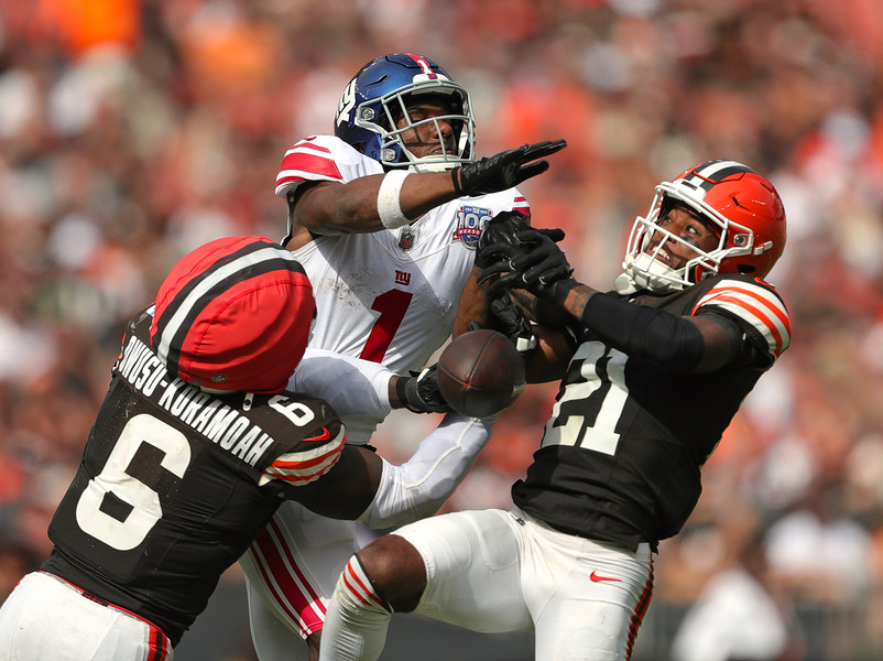 Sports - 3rd place - Cleveland Browns linebacker Jeremiah Owusu-Koramoah (6) and cornerback Denzel Ward (21) break up a pass intended for New York Giants wide receiver Malik Nabers (1) during the second half of a game at Huntington Bank Field in Cleveland. (Jeff Lange / Akron Beacon Journal)