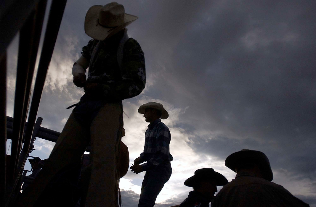 Second place, Larry Fullerton Photojournalism Scholarship - Erin Galletta / Kent State UniversityLane Morrow, left, and other bareback riders prepare behind the chutes at the Rodeo de Santa Fe.