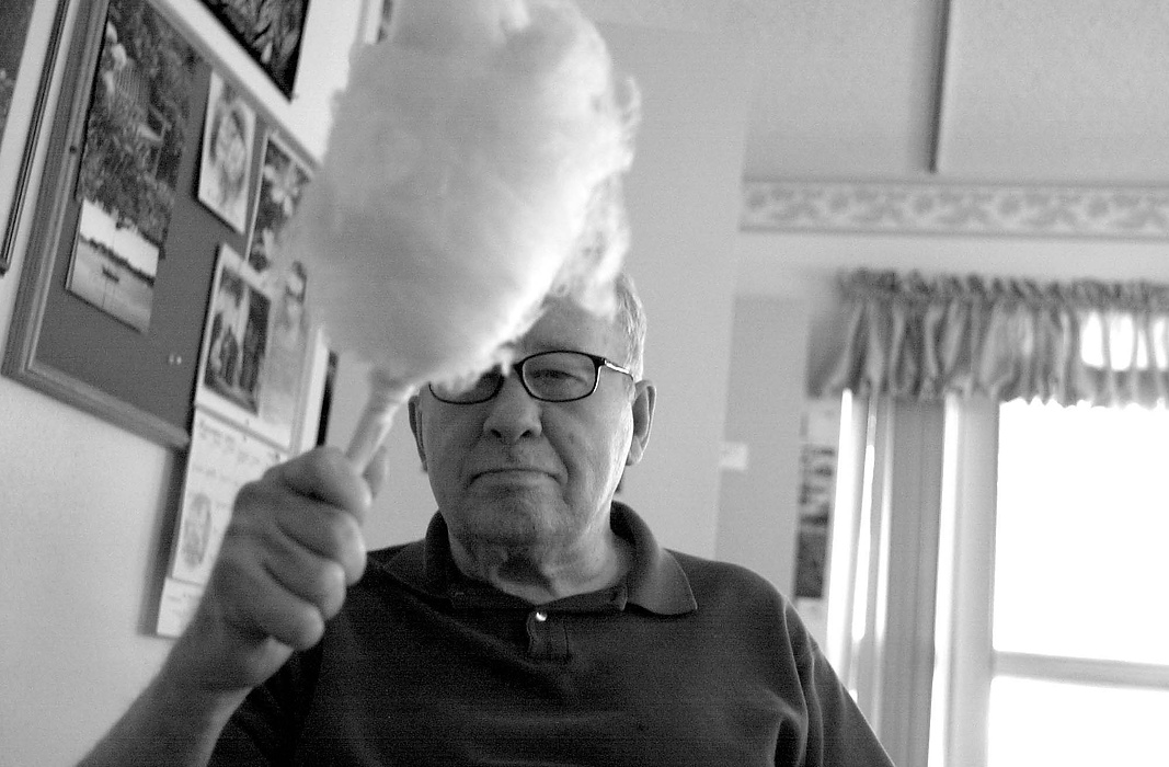 Second place, Larry Fullerton Photojournalism Scholarship - Erin Galletta / Kent State UniversityJohn Cahouet acceps the gift of cotton candy on his first day in his new home, The Santa Fe Care Center. Cahouet was forced to move after La Residencia Nursing Home  announced their closing, leaving over 100 residents with only 60 days to find a new home.