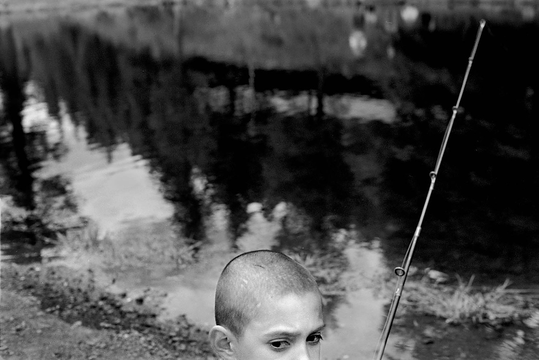 Second place, Larry Fullerton Photojournalism Scholarship - Erin Galletta / Kent State UniversityEight year-old Santiago Trujillo waits for the rewards of his patience on the graveled crust of Cowles Pond.