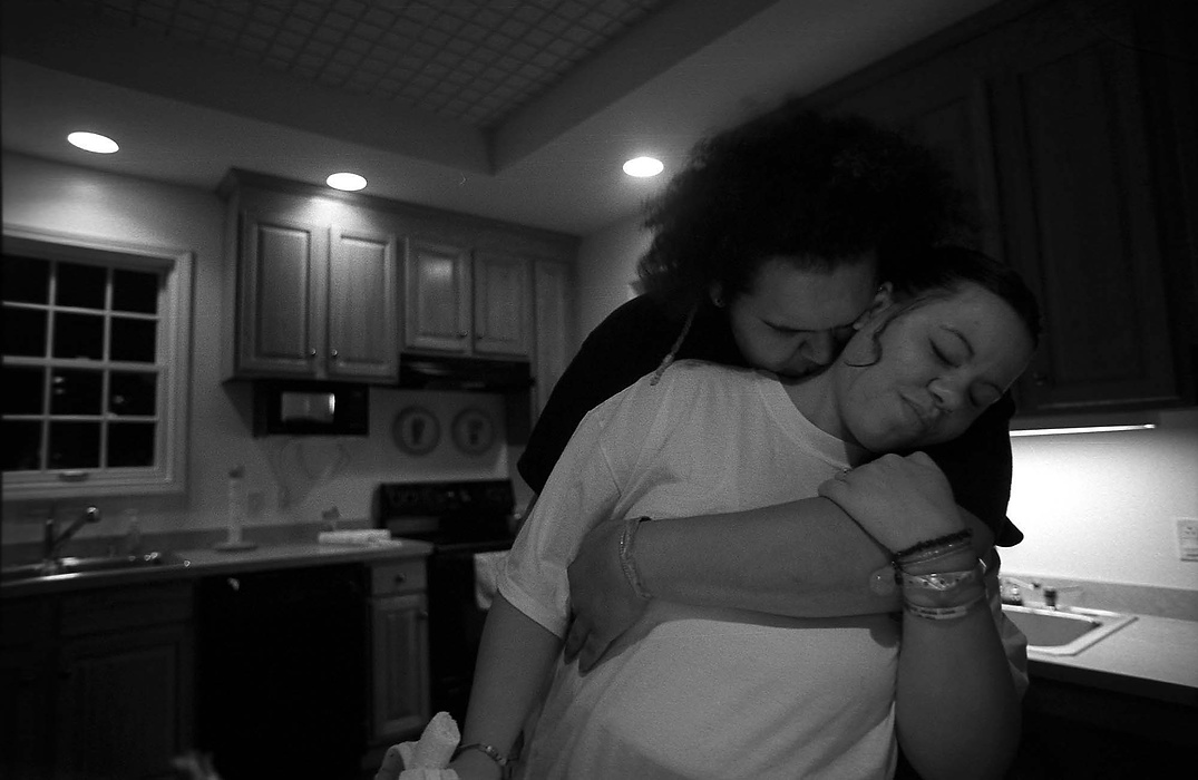 First place, Larry Fullerton Photojournalism Scholarship - Lindsay Steiner / Ohio UniversityCasi and Ricky embrace after dinner at the Ronald McDonald House in Toledo.  The house offers free rooming to families of patients at the Toledo Children's Hospital.  