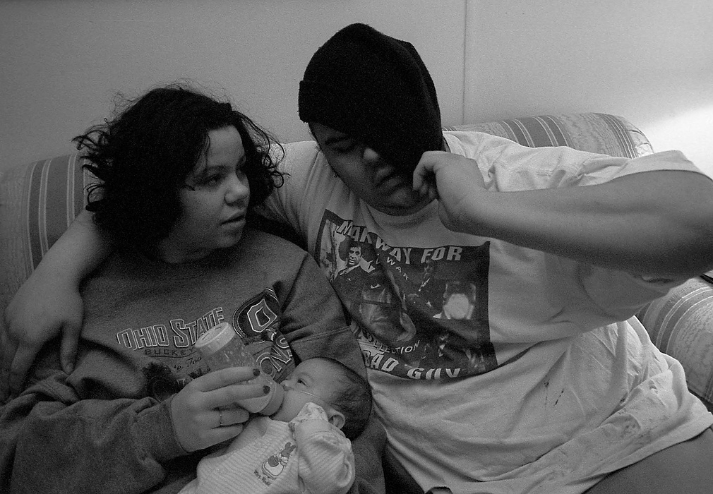 First place, Larry Fullerton Photojournalism Scholarship - Lindsay Steiner / Ohio UniversityCasi and Ricky spend a few minutes together with Isabella before Casi goes to work.  Both Casi and Ricky are juggling work and school with their new status as parents.