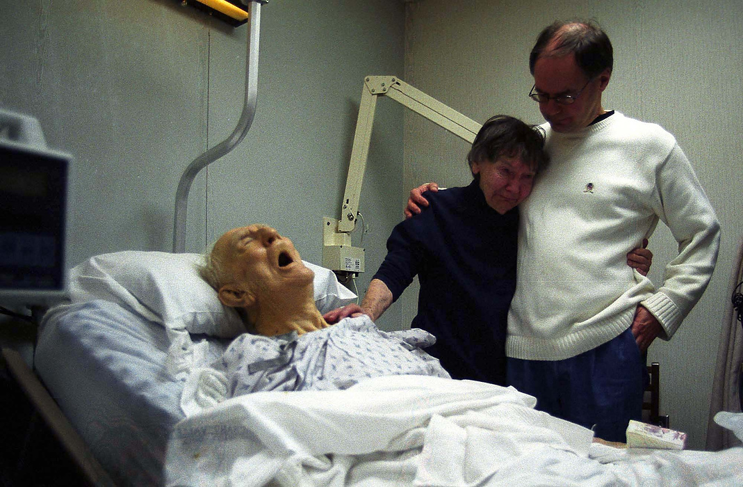 First place, Larry Fullerton Photojournalism Scholarship - Lindsay Steiner / Ohio UniversityMargaret is comforted by her son, Fred, after Nelson died from heart complications.  Less than 48 hours earlier, Nelson lost his footing and fell, breaking his hip.  "How will I leave you, my darling?  How can I go?"  cries Margaret, who will now begin a new part of her life; one without her husband of 66 years. 