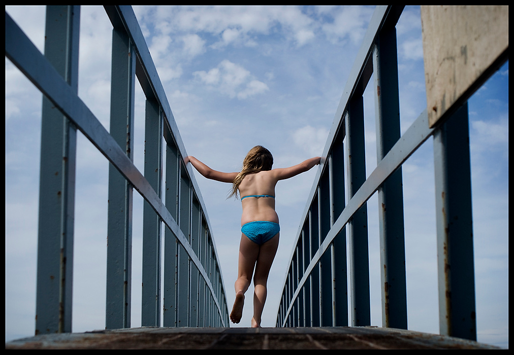 Larry Fullerton Photojournalism Scholarship - James Roh / Ohio UniversityChloe Thomson, 8, from Dunbar, Scotland walks over a bridge at Belhaven Beach, Scotland.  Thomson spent the day enjoying the weather with her siblings and mother.