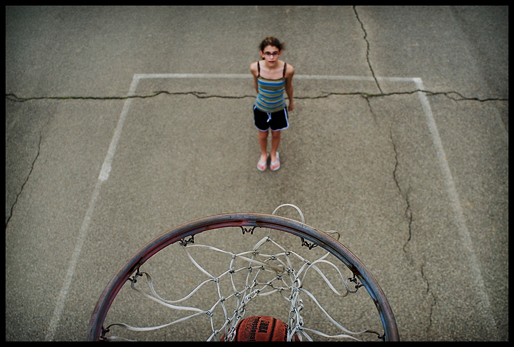 Larry Fullerton Photojournalism Scholarship - James Roh / Ohio UniversityWhitney Brooks, 14, from Amesville watches her shot go through the basket at the basketball courts by the Athens Skatepark in Athen.  This was Brooks’ first time at the courts. 
