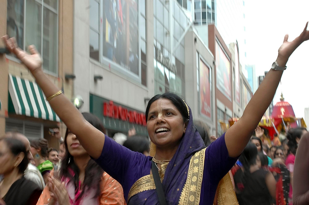 Larry Fullerton Photojournalism Scholarship - Laura Torchia / Kent State UniversityLila Manjari of North York lifts her arms in praise during the annual Ratha Yatra parade down Yonge Street.  Lila is a life-long Vaisnava devotee; a Hare Krishna.