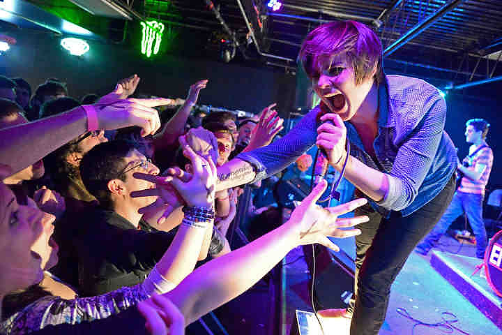 First place, Larry Fullerton Photojournalism Scholarship - Jenna Watson / Kent State UniversityMaddie Finn, lead singer of Cleveland-based alternative group Envoi, connects with fans at the band's EP release show at the Outpost in Kent.