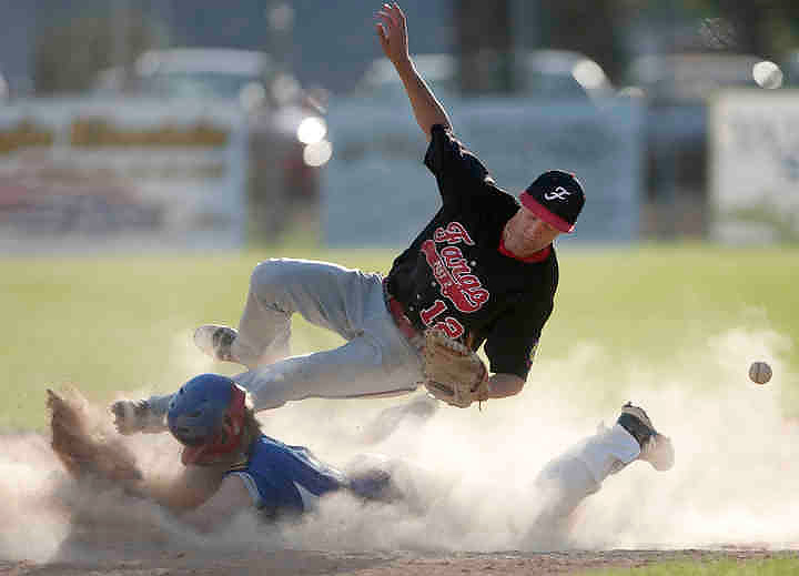 First place, Larry Fullerton Photojournalism Scholarship - Jenna Watson / Kent State UniversityFargo shortstop Jake Salentine dives for a catch in attempt to tag East Grand Forks' Hunter Aubol, as he slides safely into second base during a game at Stauss Field in East Grand Forks, Minn.. East Grand Forks Legion Post 157 lost to Fargo Legion Post 2, with a final score of 3-6.