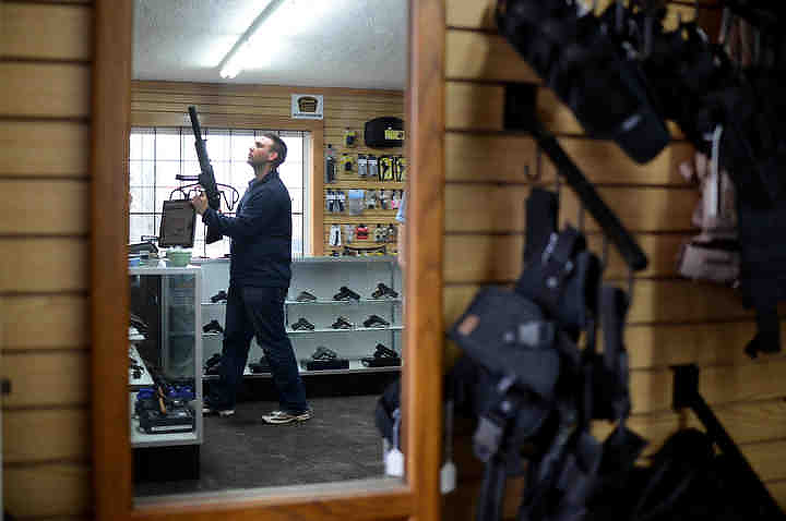 First place, Larry Fullerton Photojournalism Scholarship - Jenna Watson / Kent State UniversityDiamond, Ohio resident Adam Nowak browses at Sporting Defense LLC. Larry John opened the gun shop in Brimfield, Ohio in August of 2012. John said sales had been higher than ever, especially due to the gun control debate resulting from the school shootings about a month prior in Connecticut. 