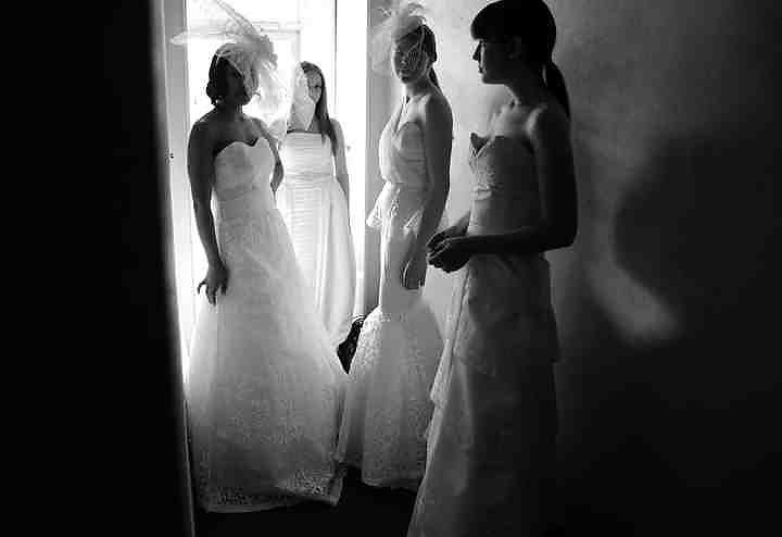 First place, Larry Fullerton Photojournalism Scholarship - Jenna Watson / Kent State UniversityModels wearing a collection of student-made wedding gowns wait backstage during the Kent Fashion Week showcase at 157 Lounge in Kent. 