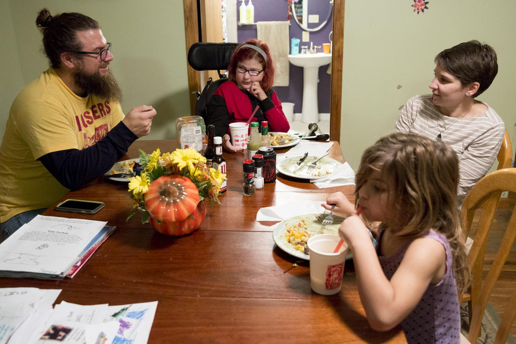 Second place, Larry Fullerton Photojournalism Scholarship - Alex Driehaus / Ohio UniversityAdyn sits at the dinner table with her parents, Brian and Lucy, and her sister Seneca  at their home in Athens.