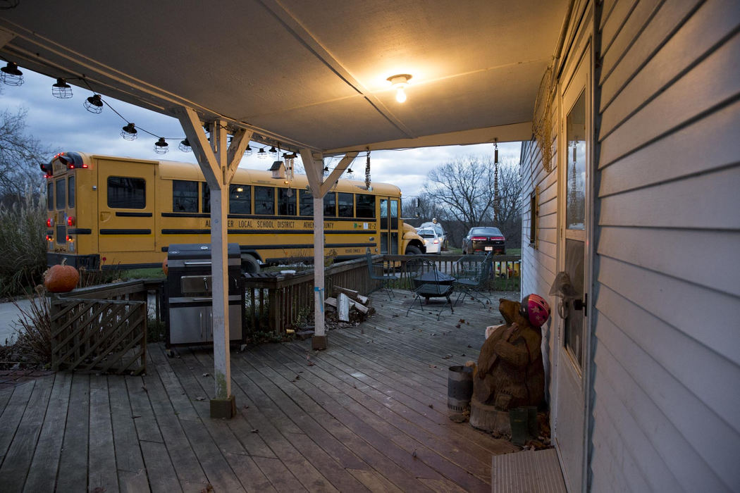 Second place, Larry Fullerton Photojournalism Scholarship - Alex Driehaus / Ohio UniversityThe school bus leaves the Bucher house on the morning of November 13, 2015. The bus comes directly to the house rather than to a bus stop in order to make it easier for Adyn to get to school.